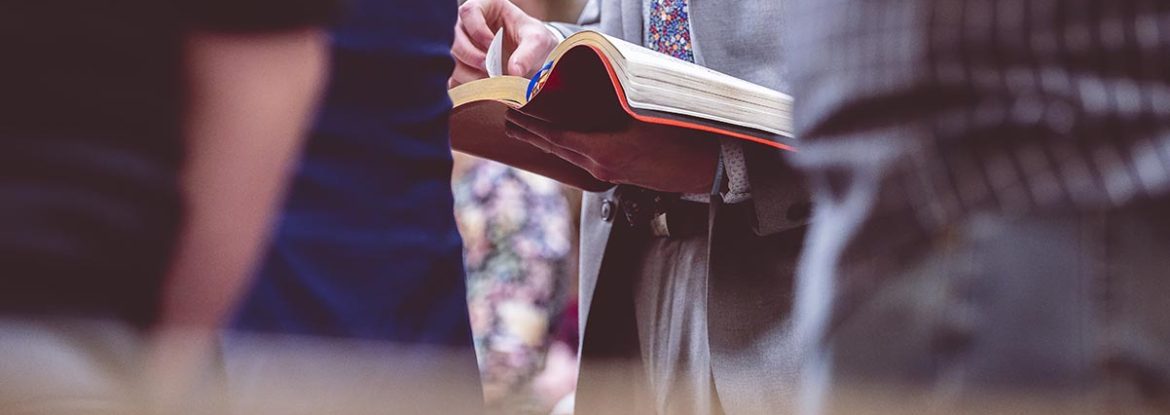 A woman reading the Bible during a church gathering